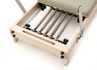 Reformer Pilates in legno salvaspazio Mooma